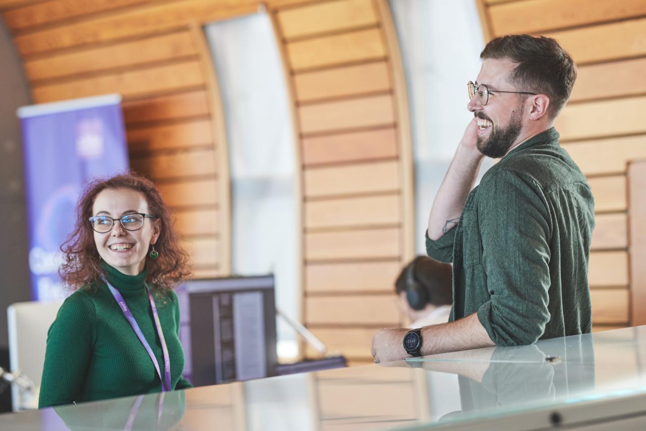 Two colleagues in the modern office smiling