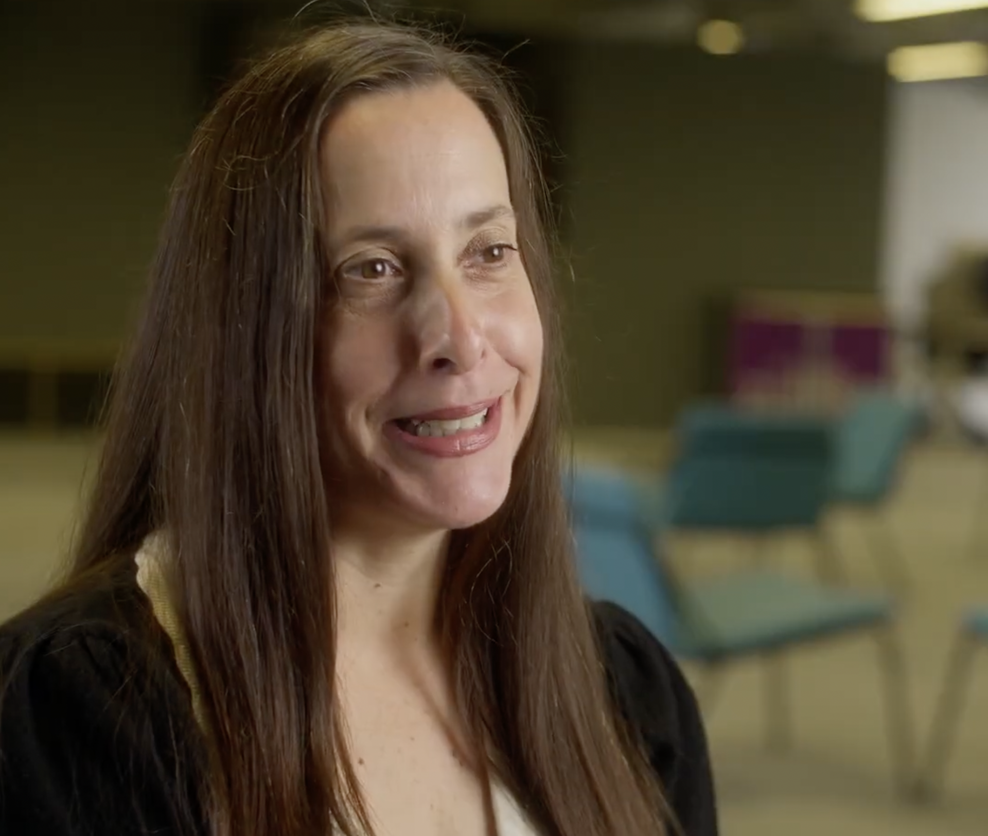 A smiling woman portrait in an office setting