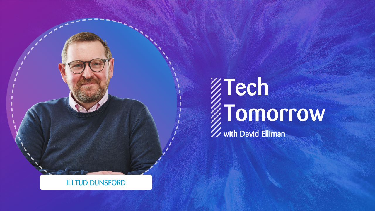 Podcast promotional graphic for ‘Tech Tomorrow with David Elliman’. On the left, a man with glasses, short hair, and a beard, wearing a navy jumper over a collared shirt, is framed in a dotted circle. A white label beneath identifies him as ‘Illtud Dunsford’. On the right, the podcast title appears in white text on a purple and blue abstract background.