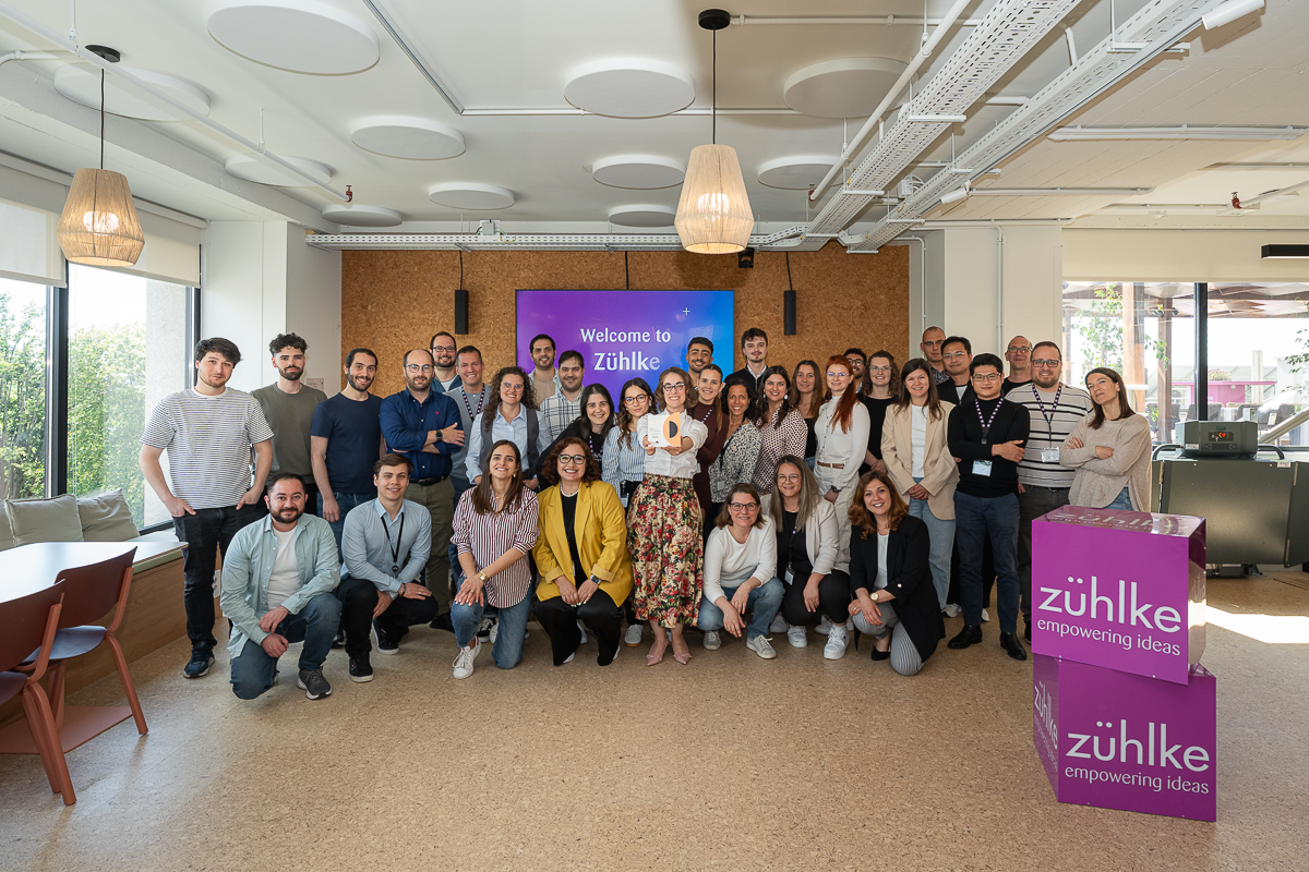 Coverflex award celebration at Zühlke office in Porto - a large group of colleagues posing for the photo