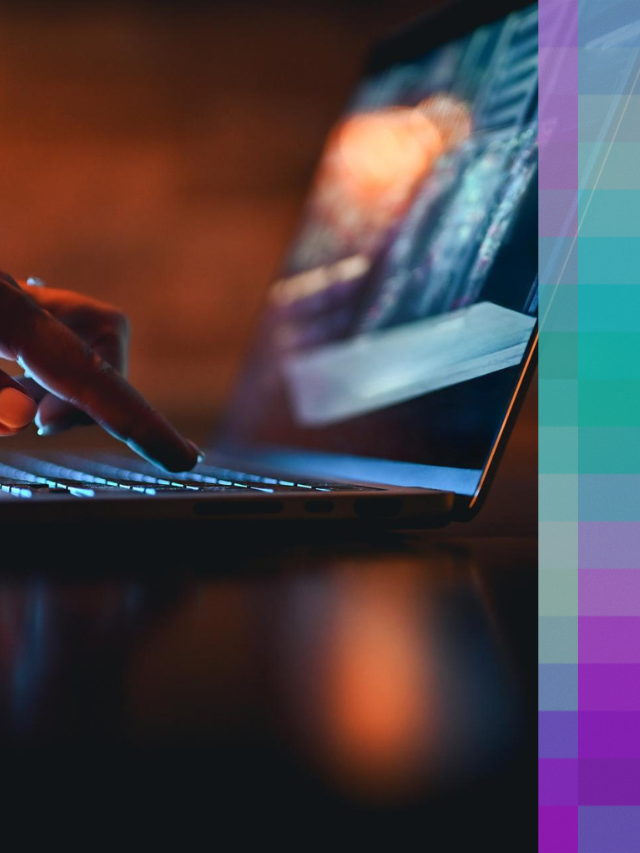 Close-up of a hand typing on a laptop, illuminated by screen light, representing hands-on development work.