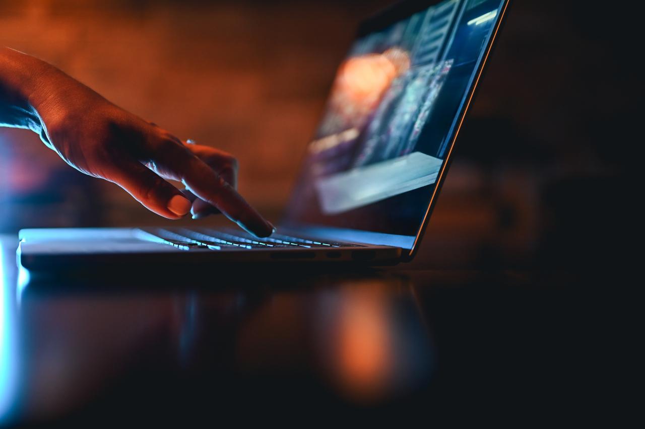 Hand typing on computer keyboard