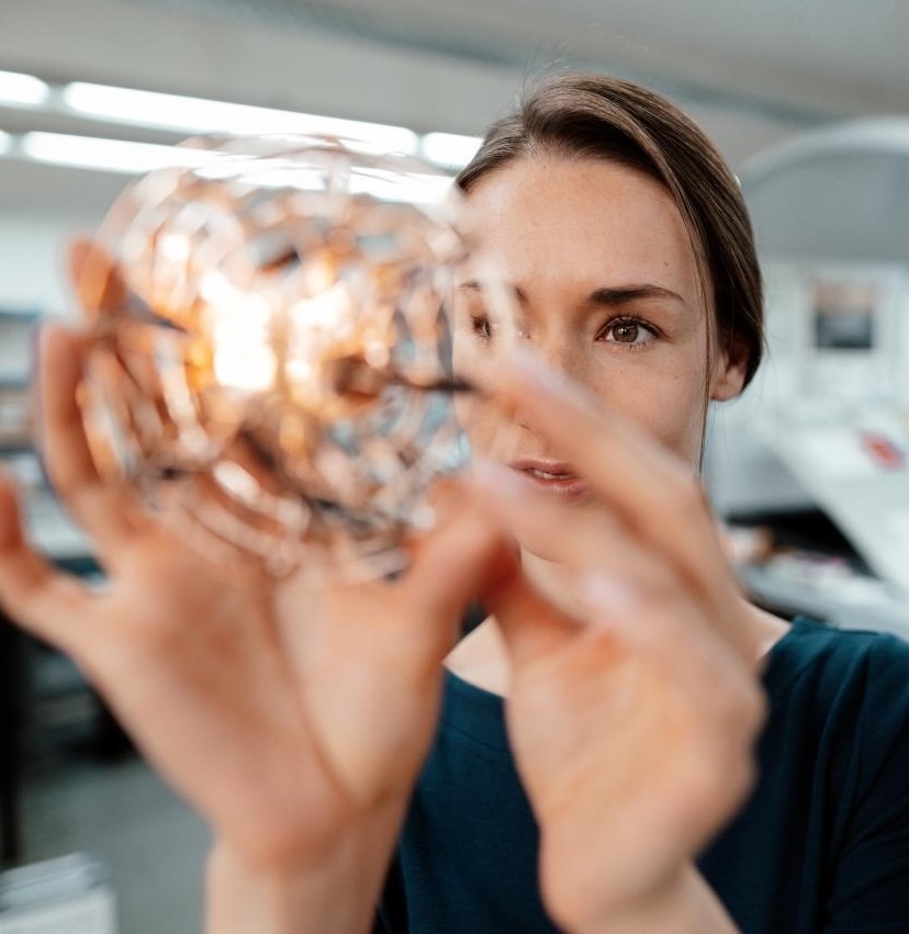 Female design professional checking 3D drone in industry