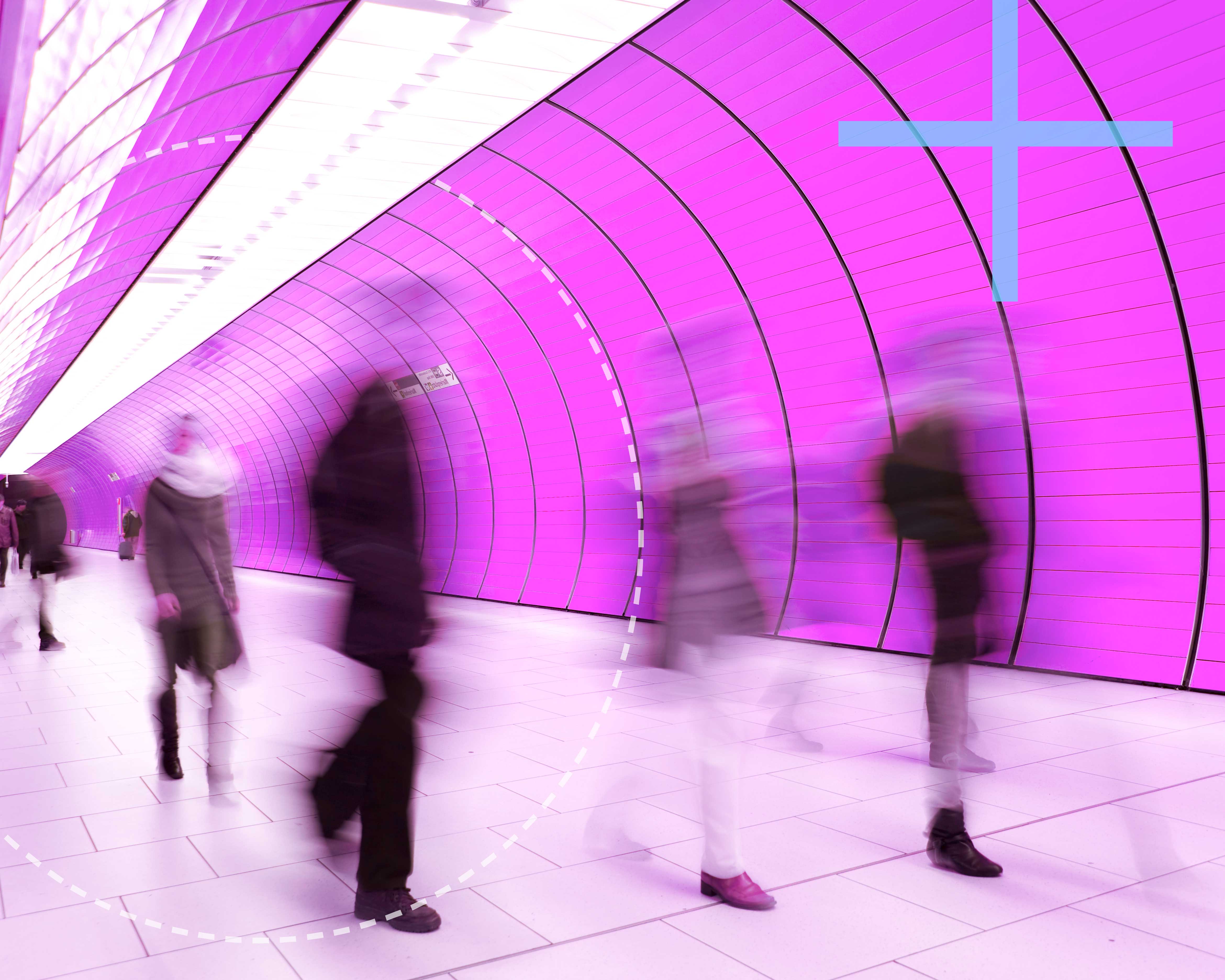 people walking in tunnel